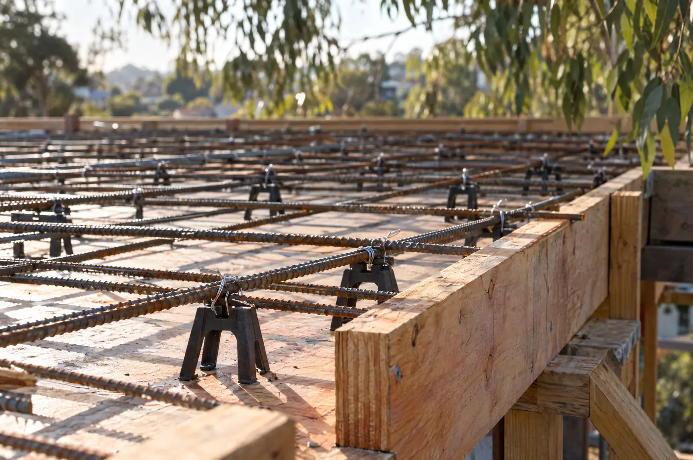 Reinforcing mesh and bars laid in formwork before a concrete pour on a Sydney site